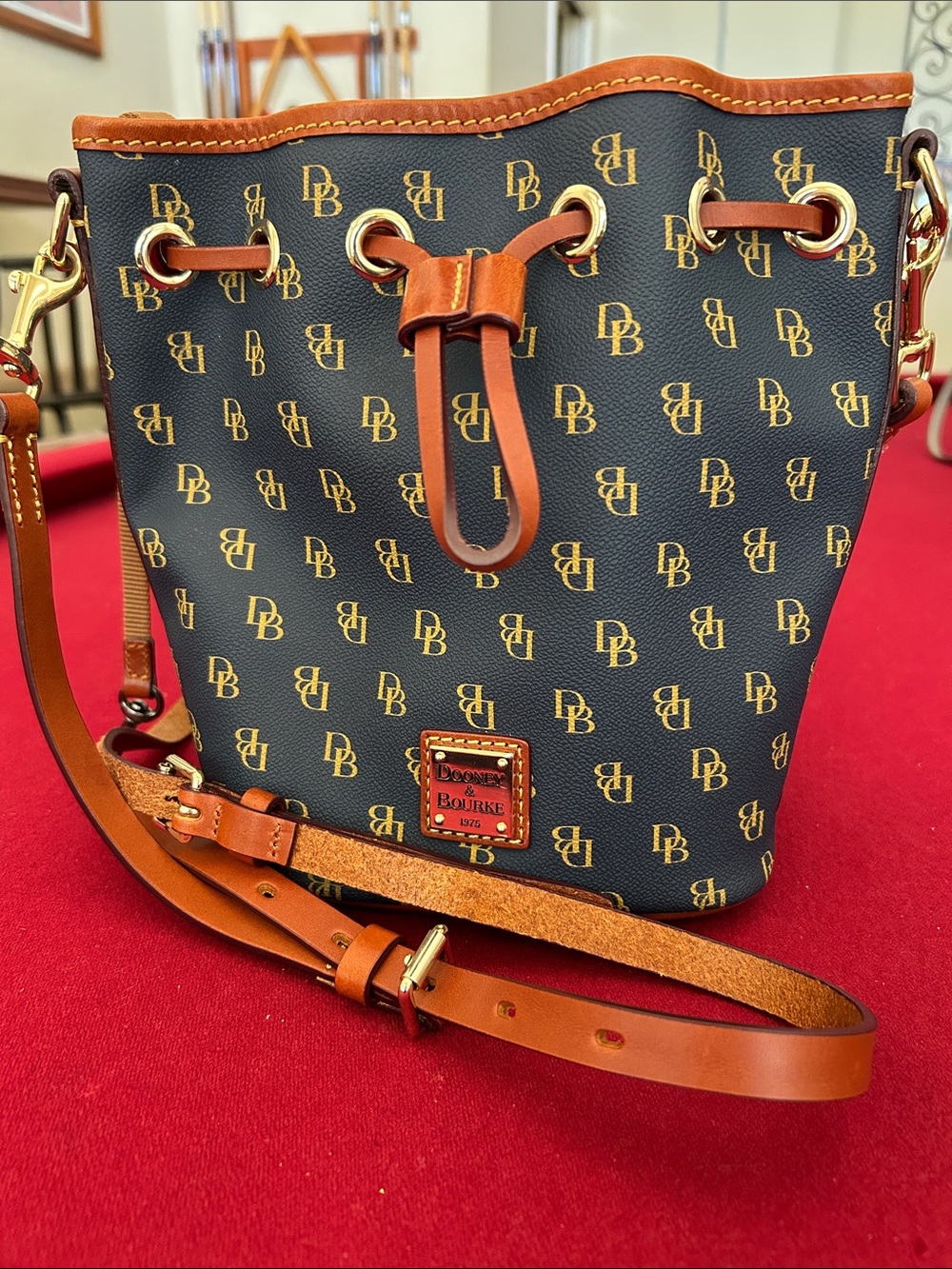 Dooney & Bourke Navy and Chestnut Signature Drawstring Crossbody
